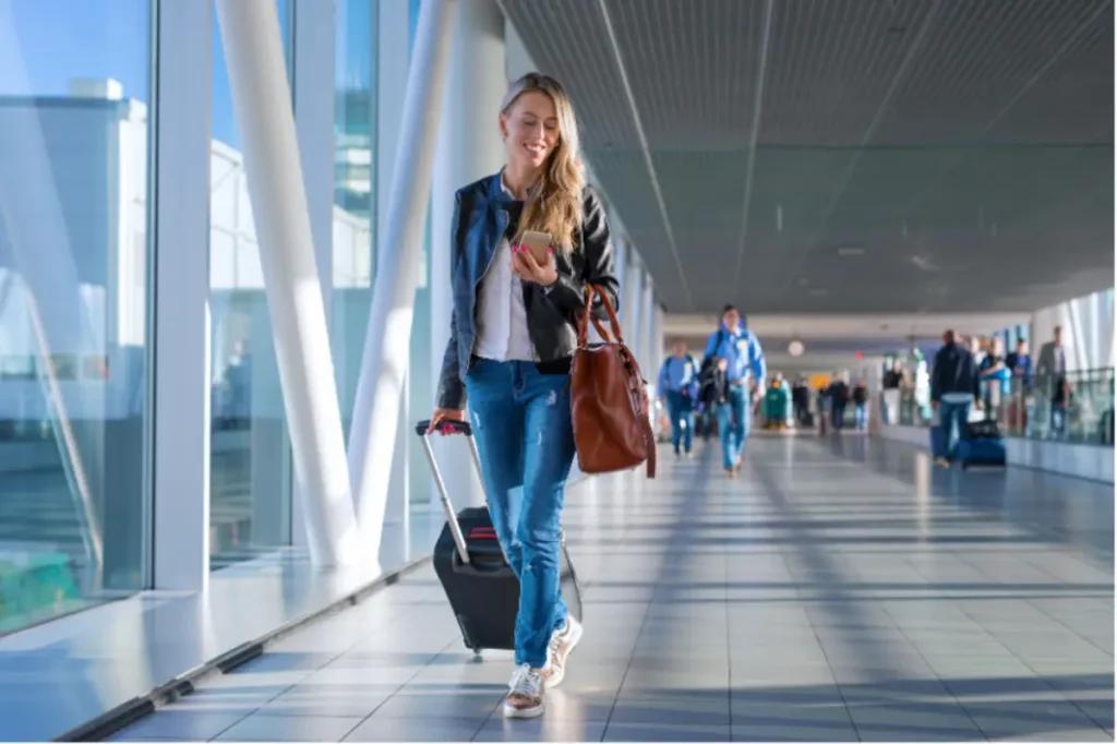 Young woman traveling comfortably with personalized travel concierge support for treatment