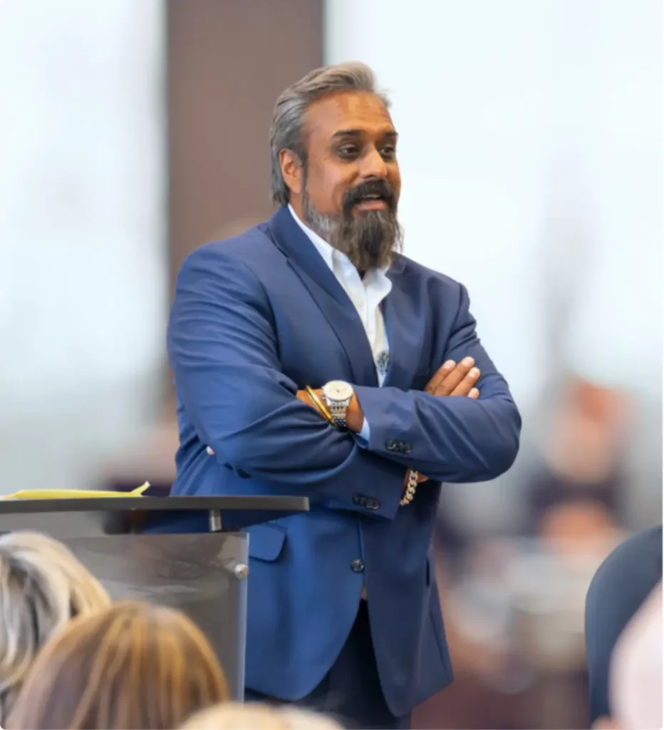 Dr. Ash Bhatt leading a clinical discussion in a professional setting