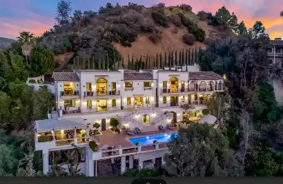 Luxury hillside rehab mansion in Los Angeles with balconies, infinity pool, and panoramic sunset views at Villa Fiona Castilian