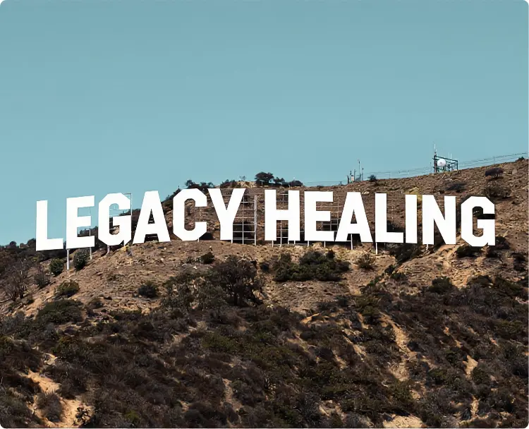 Sign on hillside reads 'Legacy Healing'