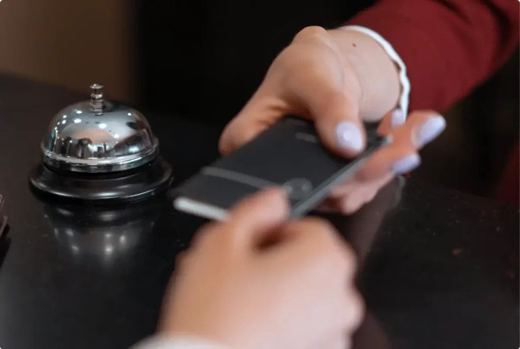 Concierge desk with service bell showing musician travel and recovery support services.